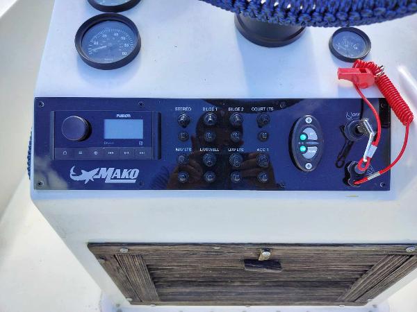 Slide: The Image of 1988 Mako 171 Center Console dashboard with controls and gauges. - 3