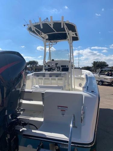 Slide: The Image of 2024 Mako 214 CC center console boat with outboard motor. - 2