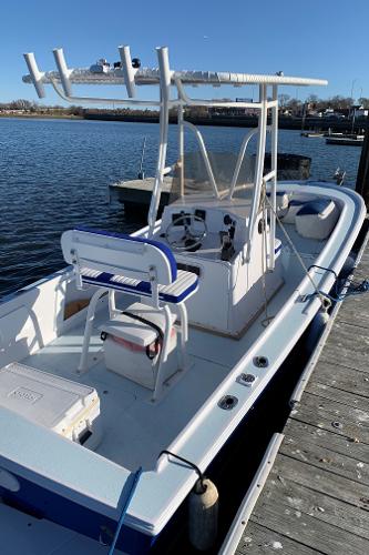 Slide: The Image of 1980 Mako 23 boat docked by the water on a sunny day. - 3