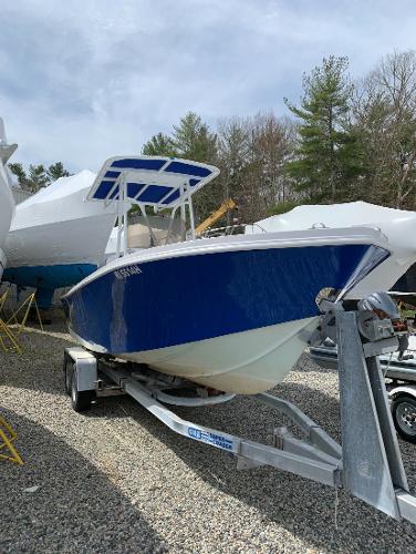 Slide: The Image of 1980 Mako 23 boat on trailer, blue hull, parked outdoors. - 4