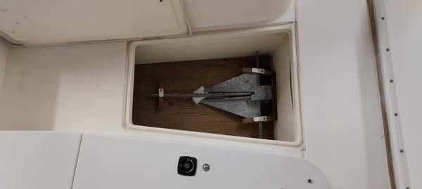 Slide: The Image of Anchor storage compartment on a 1990 Mako 261 Center Console boat. - 15