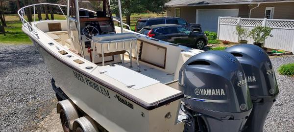 Slide: The Image of 1990 Mako 261 Center Console boat with dual Yamaha 200 engines on a trailer. - 3