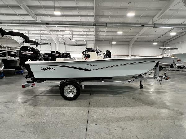 Slide: The Image of 2023 Mako Pro Skiff 13 CC boat on trailer in showroom. - 1