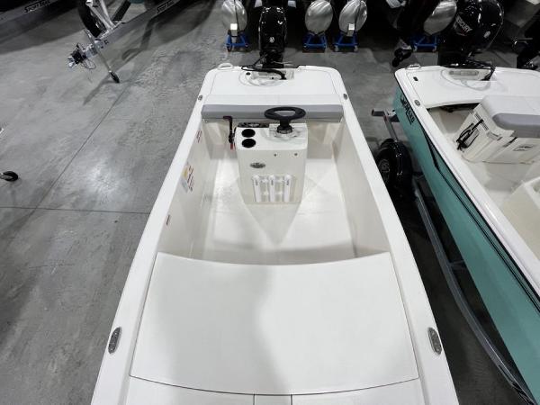 Slide: The Image of 2023 Mako Pro Skiff 13 CC boat interior, top view, in showroom. - 13