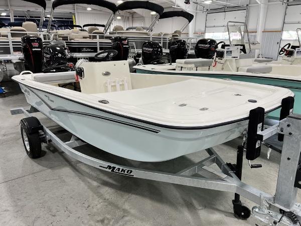 Slide: The Image of 2023 Mako Pro Skiff 13 CC boat on trailer in showroom. - 3