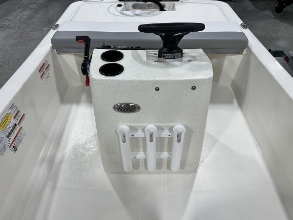 Slide: The Image of 2023 Mako Pro Skiff 13 CC center console with steering wheel and rod holders. - 4
