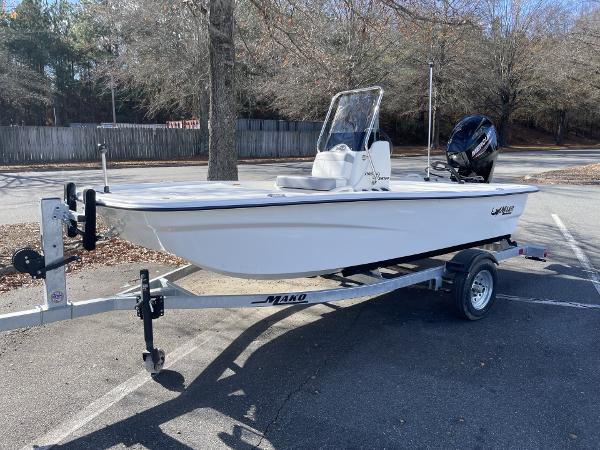 Slide: The Image of 2024 Mako Pro Skiff 13 CC boat on trailer in parking lot. - 1