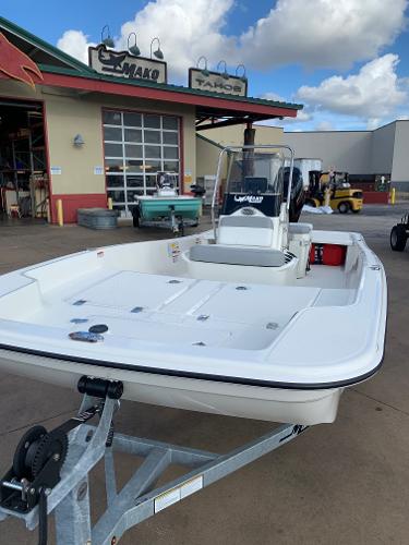 Slide: The Image of 2024 Mako Pro Skiff 15 CC boat on trailer at dealership. - 5