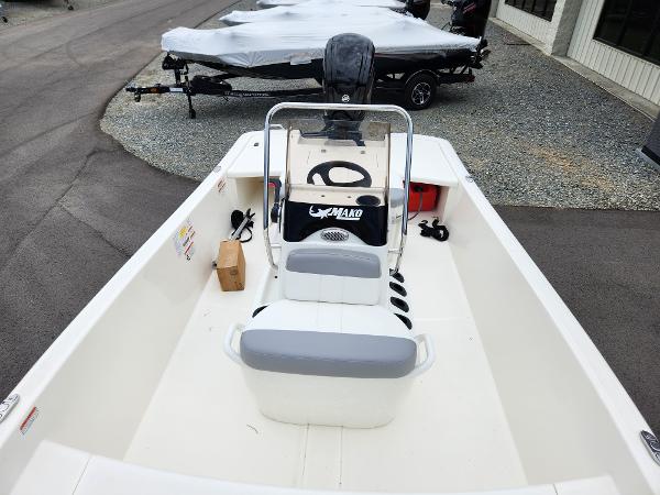 Slide: The Image of 2024 Mako Pro Skiff 17 CC boat interior with console and seating. - 7