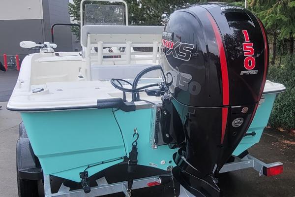 Slide: The Image of 2024 Mako Pro Skiff 19 CC with Mercury 150 Pro XS outboard motor. - 2