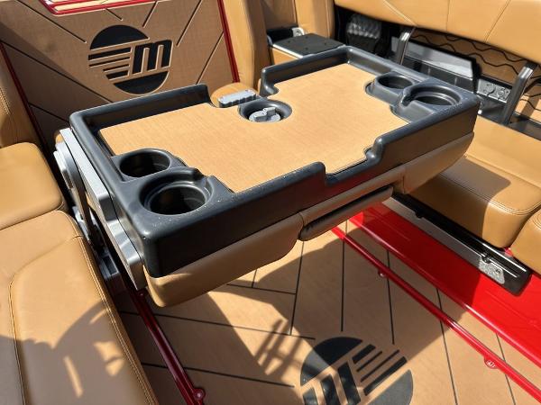 Slide: The Image of 2025 Malibu 23 LSV interior with foldable table and cup holders. - 12