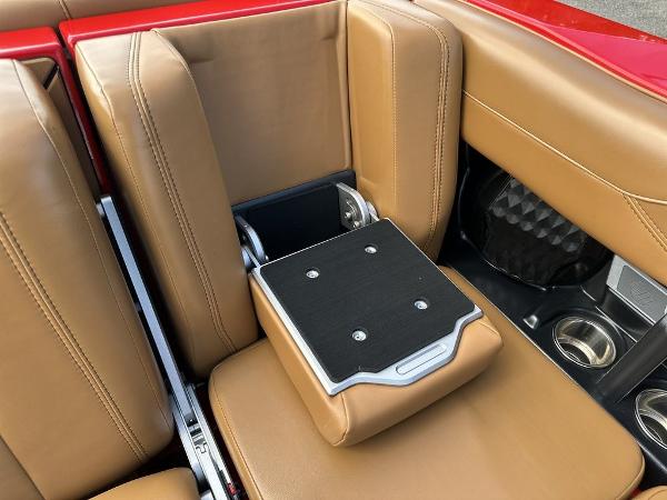 Slide: The Image of 2025 Malibu 23 LSV interior with tan leather seats and cup holders. - 14