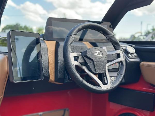 Slide: The Image of 2025 Malibu 23 LSV dashboard with modern steering wheel and digital displays. - 17
