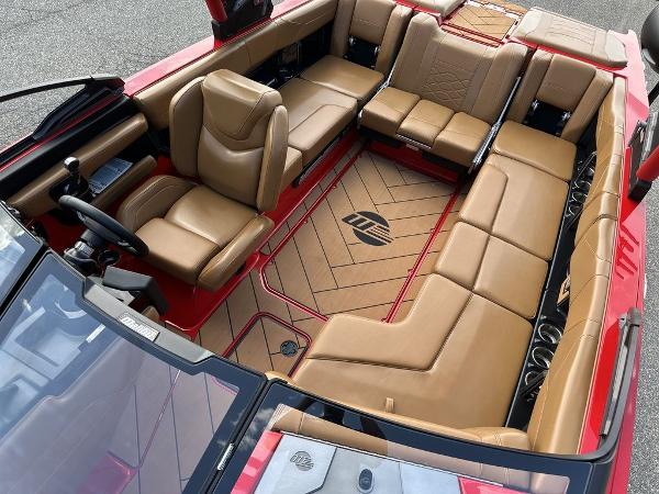 Slide: The Image of Luxurious interior of 2025 Malibu 23 LSV boat with tan leather seating. - 19