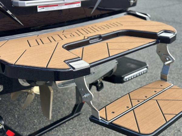 Slide: The Image of 2025 Malibu 23 LSV swim platform with teak finish and stainless steel accents. - 8