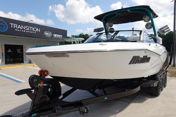 Slide: The Image of 2023 Malibu 25 LSV boat at Transition Watersports dealership. - 2