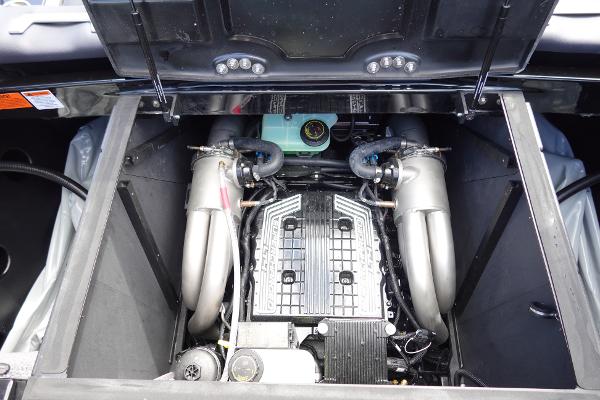 Slide: The Image of 2023 Malibu 25 LSV boat engine compartment with open hatch. - 27