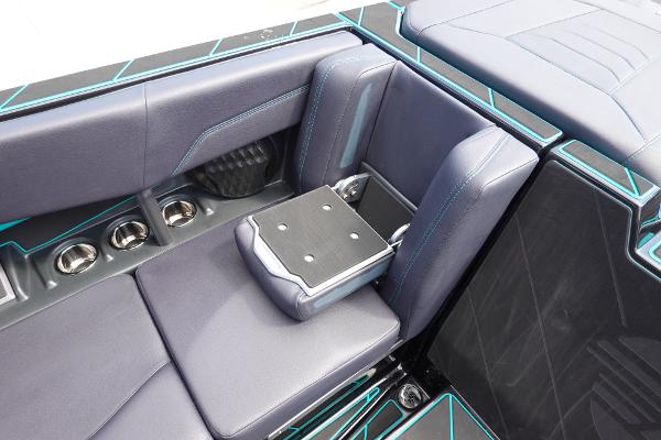 Slide: The Image of 2023 Malibu 25 LSV boat interior with luxurious seating and cup holders. - 29