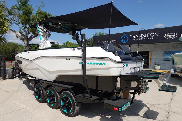 Slide: The Image of 2023 Malibu 25 LSV boat on trailer at Transition Watersports dealership. - 43