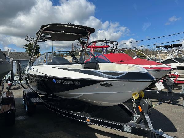 Slide: The Image of 2013 Malibu Wakesetter 20 VTX boat on trailer under blue sky. - 1