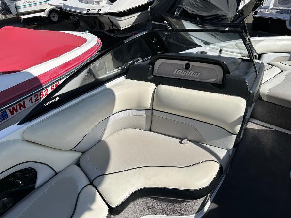Slide: The Image of 2013 Malibu Wakesetter 20 VTX boat interior with white and black seating. - 10