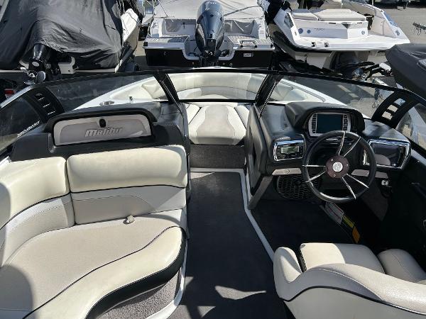 Slide: The Image of 2013 Malibu Wakesetter 20 VTX boat interior with seating and steering console. - 11