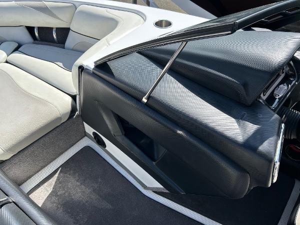 Slide: The Image of Interior of 2013 Malibu Wakesetter 20 VTX boat with sleek seating and dashboard. - 16