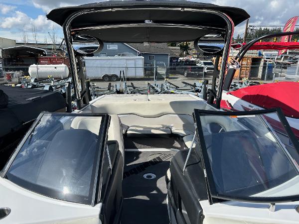 Slide: The Image of 2013 Malibu Wakesetter 20 VTX boat interior with open windshield and seating area. - 18
