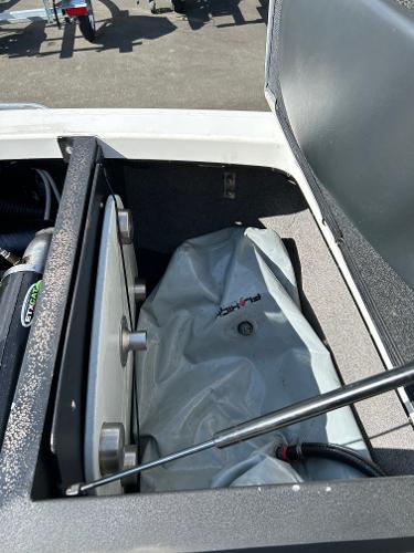Slide: The Image of 2013 Malibu Wakesetter 20 VTX storage compartment with ballast bag visible. - 19