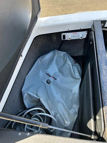 Slide: The Image of 2013 Malibu Wakesetter 20 VTX storage compartment with ballast bag and wiring. - 20