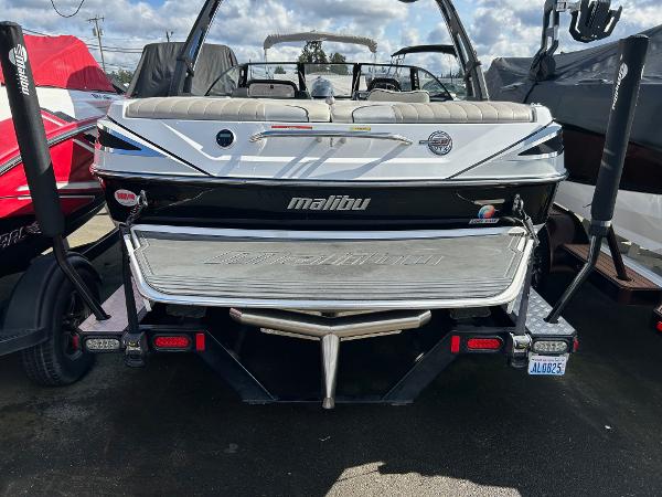 Slide: The Image of 2013 Malibu Wakesetter 20 VTX boat, rear view, parked outdoors. - 22