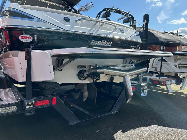 Slide: The Image of 2013 Malibu Wakesetter 20 VTX boat rear view with trailer, sunny day. - 3
