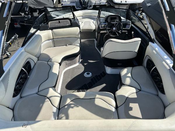 Slide: The Image of 2013 Malibu Wakesetter 20 VTX boat interior with plush seating and modern dashboard. - 6