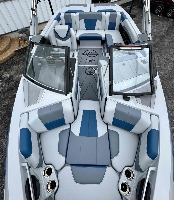 Slide: The Image of 2024 Malibu 20 VTX boat interior with blue and gray seating. - 8