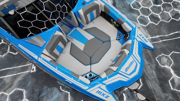 Slide: The Image of 2021 Malibu Wakesetter 24 MXZ boat, blue and gray interior, top view. - 11