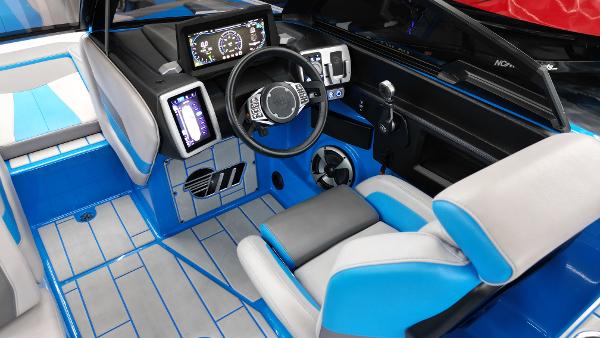 Slide: The Image of 2021 Malibu Wakesetter 24 MXZ interior with blue accents and modern dashboard. - 8