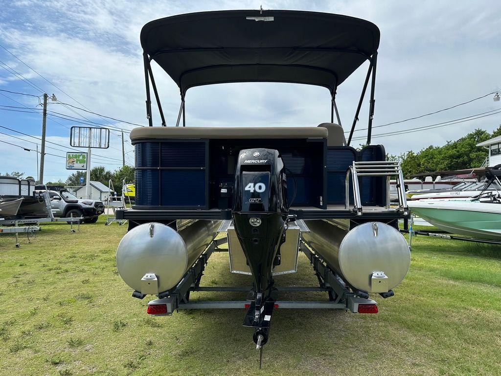 Slide: The Image of 2022 Manitou 18 Aurora LE Standard Twin Tube pontoon boat with Mercury 40 HP engine. - 10
