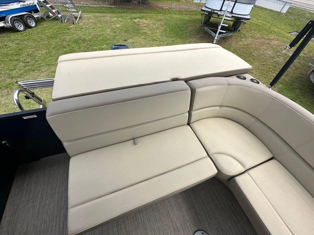 Slide: The Image of 2022 Manitou 18 Aurora LE Standard Twin Tube boat interior seating area. - 16