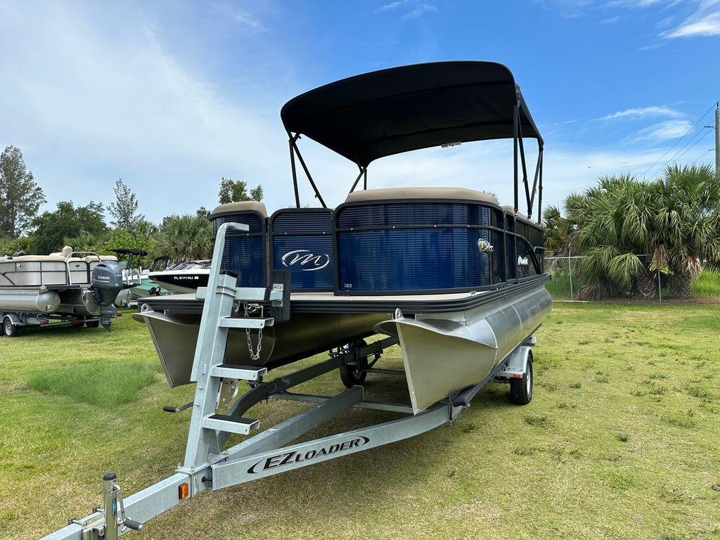 Slide: The Image of 2022 Manitou 18 Aurora LE Standard Twin Tube pontoon boat on EZ Loader trailer. - 4
