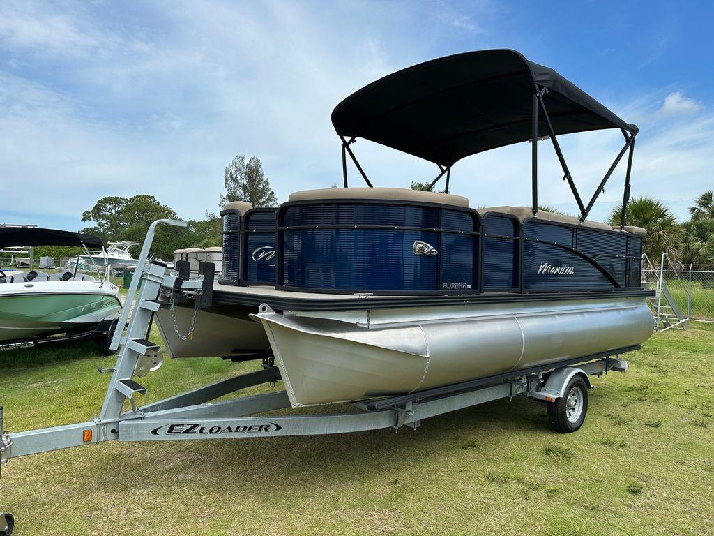 Slide: The Image of 2022 Manitou 18 Aurora LE Standard Twin Tube pontoon boat on EZ Loader trailer. - 5