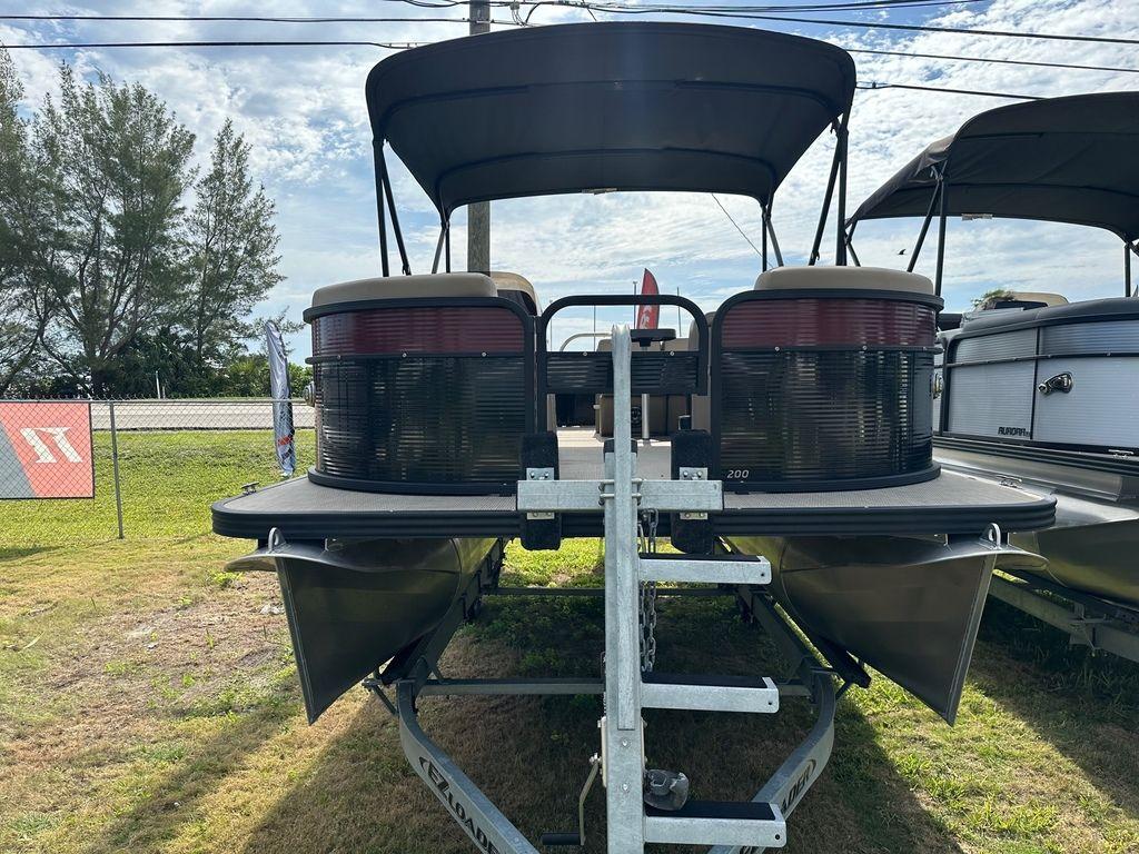 Slide: The Image of 2022 Manitou 20 Aurora LE Angler Full Front Twin Tube pontoon boat on trailer. - 8