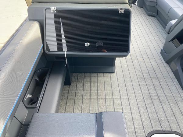 Slide: The Image of 2024 Manitou 24 EXPLORE SWITCHBACK interior seating and storage area. - 10