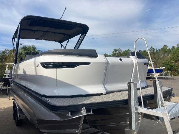 Slide: The Image of 2024 Manitou 24 EXPLORE SWITCHBACK pontoon boat with canopy and rear ladder. - 20