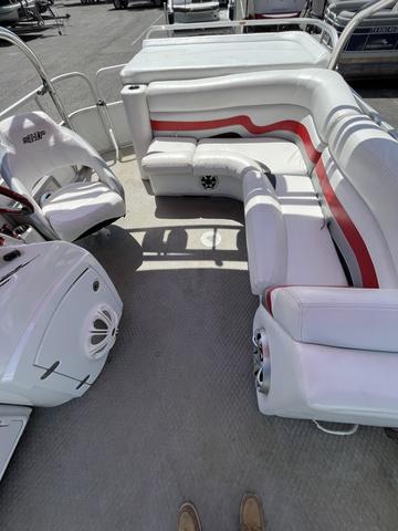 Slide: The Image of 2008 Manitou 24 X-Plode Cruise boat interior with white and red seating. - 10