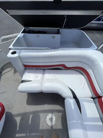 Slide: The Image of 2008 Manitou 24 X-Plode Cruise boat interior with white and red seating and storage compartment. - 14