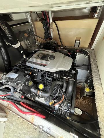 Slide: The Image of Engine compartment of 2008 Manitou 24 X-Plode Cruise boat, showcasing mechanical components. - 15