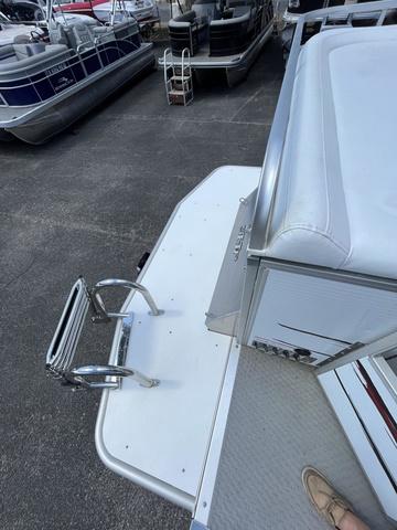 Slide: The Image of 2008 Manitou 24 X-Plode Cruise pontoon boat with white seating and metal railing. - 16