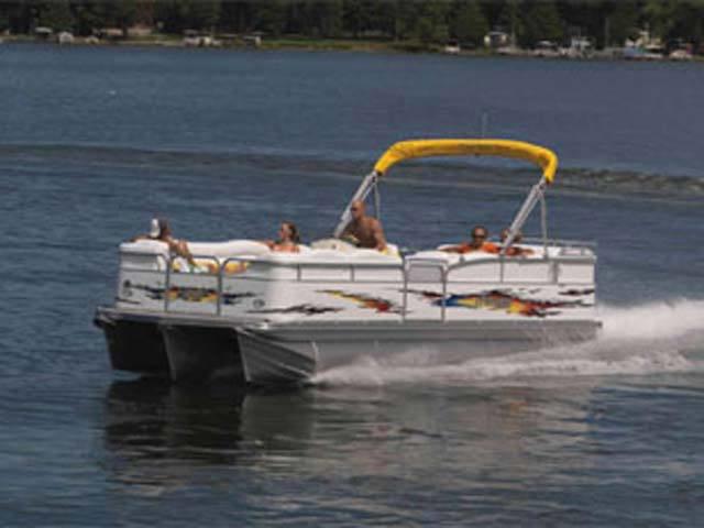 Slide: The Image of 2008 Manitou 24 X-Plode Cruise pontoon boat cruising on a lake. - 2
