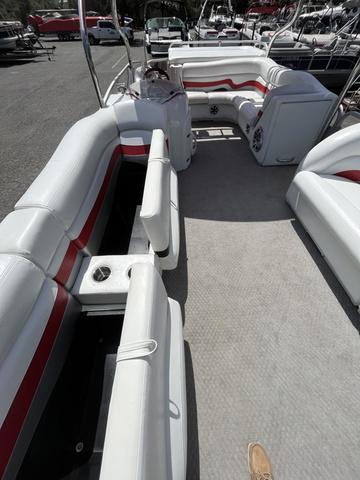 Slide: The Image of 2008 Manitou 24 X-Plode Cruise pontoon boat interior with white and red seating. - 8