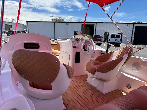 Slide: The Image of Luxurious 2025 MarinBoat Tango interior with quilted seats and modern dashboard. - 9